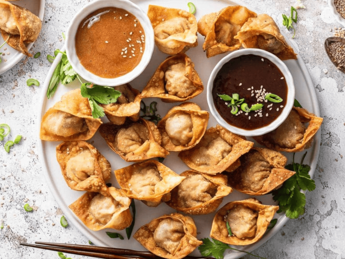 Wontons on plate with sauce