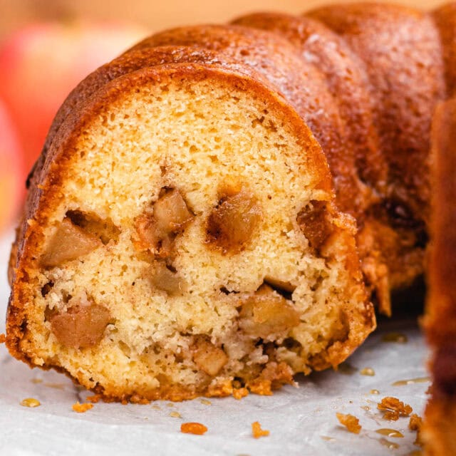 Close-up of sliced cake with apples.