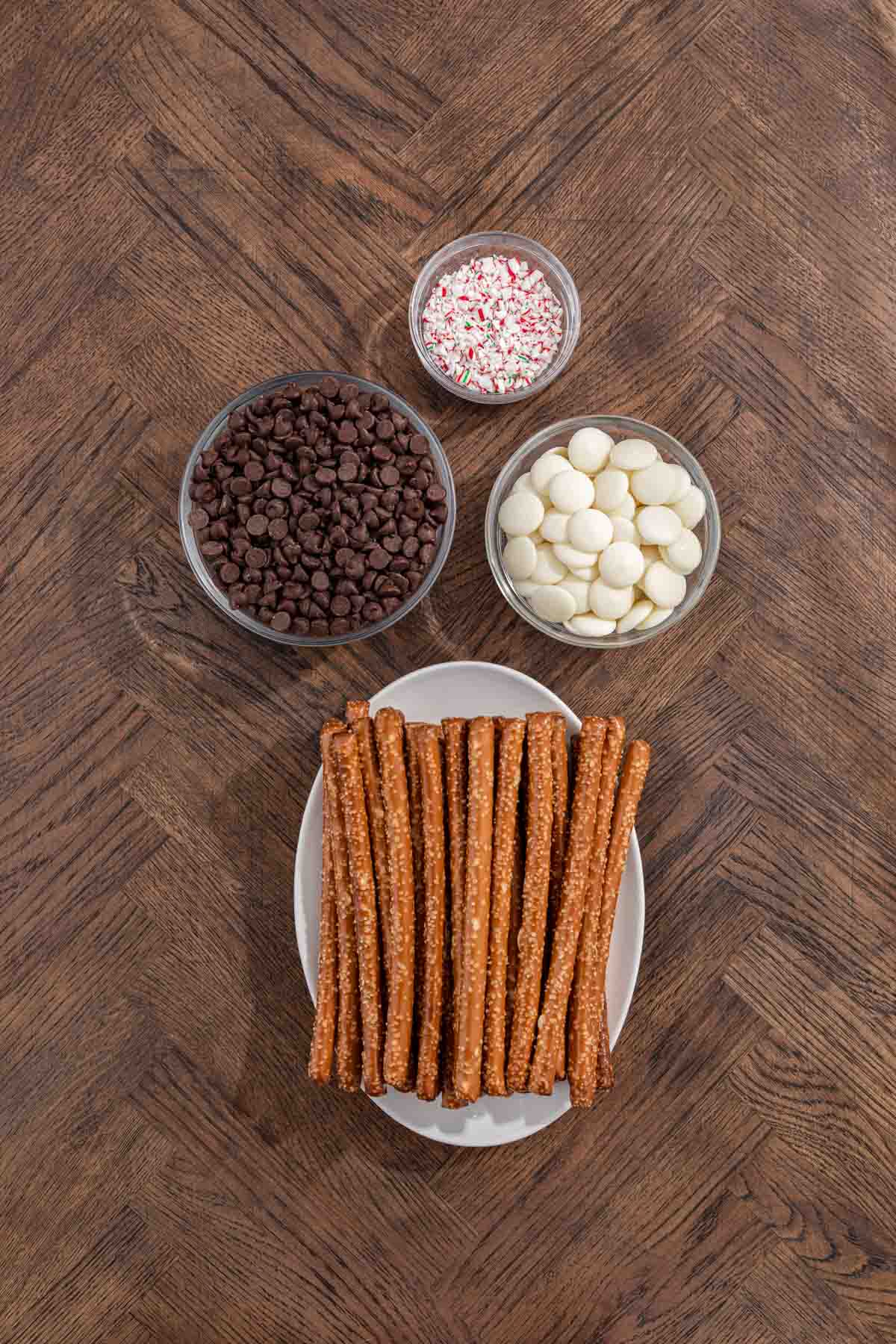Peppermint Bark Pretzel ingredients separated in bowls and plate