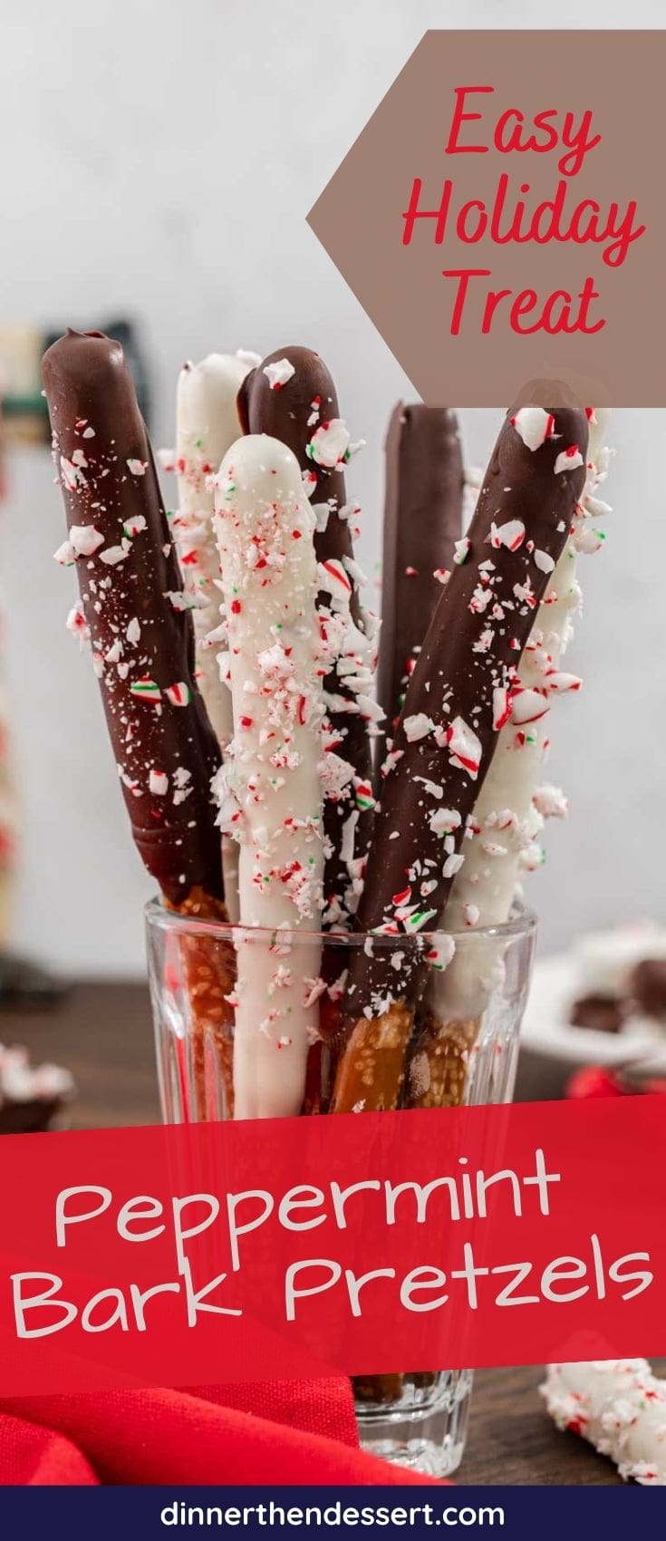Peppermint Bark Pretzels dipped in chocolate and covered in candy cane pieces in cup