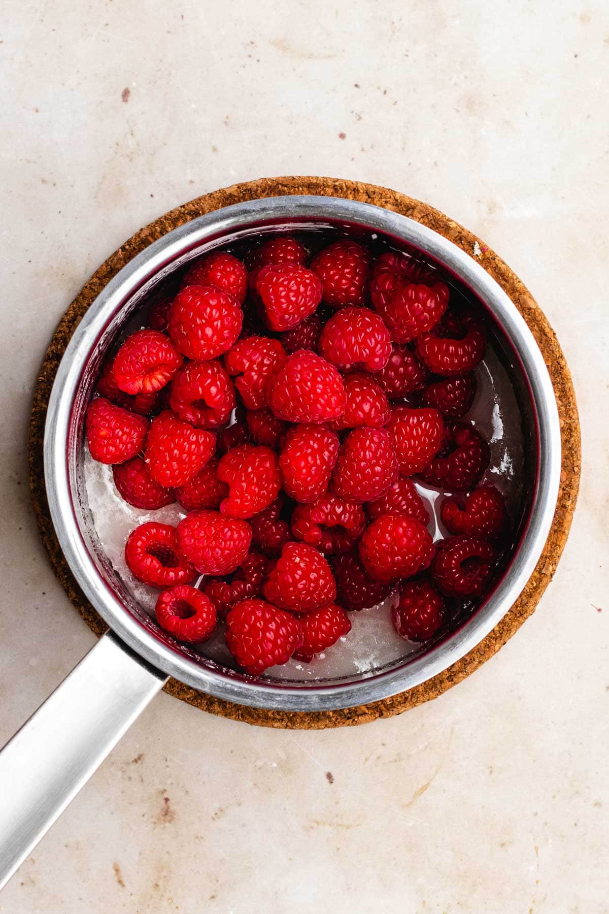 Raspberry Sauce berries in pan before cooking