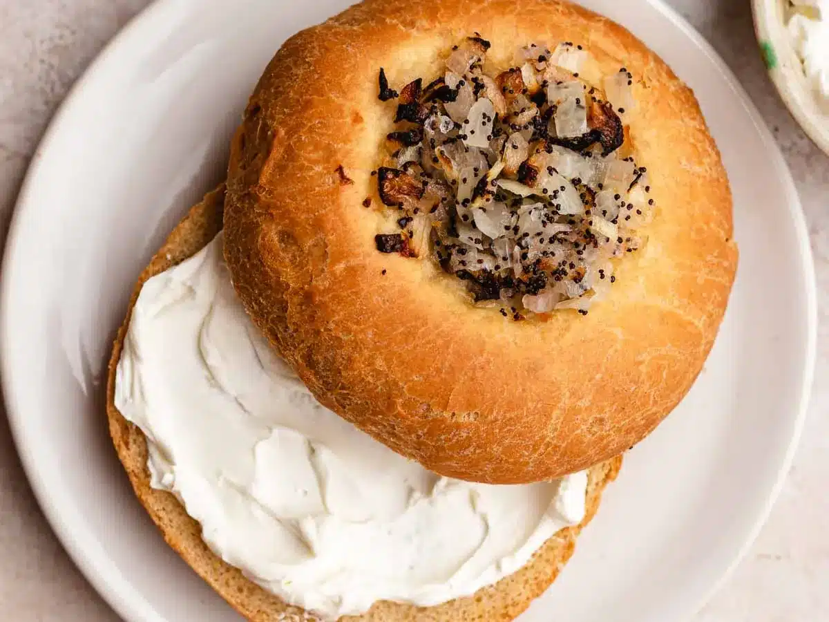Toasted roll with cream cheese spread.