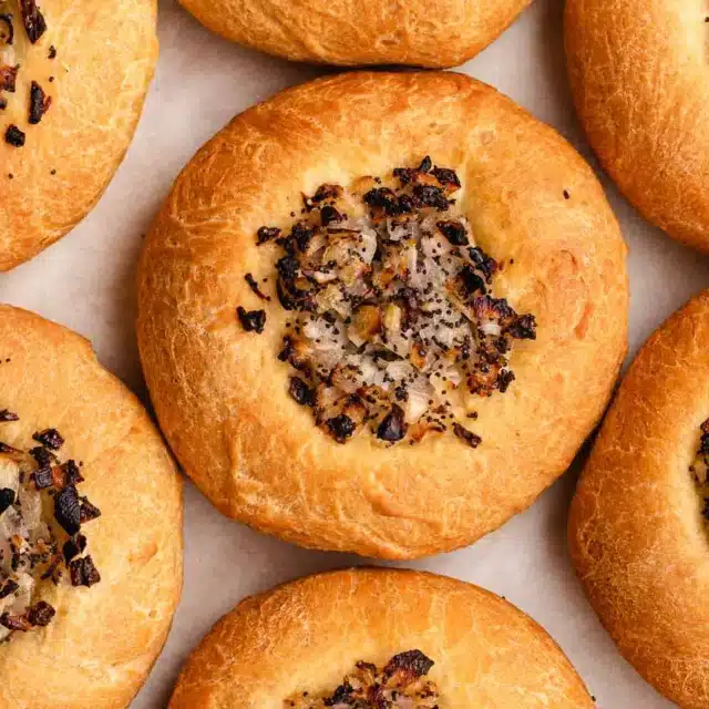 Savory rolls on parchment paper.