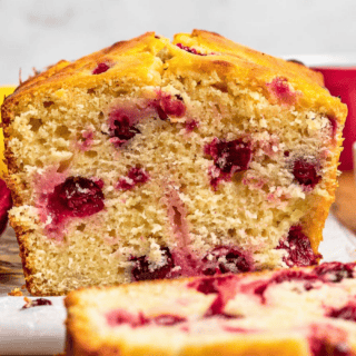 a slice of citrus tart loaf with one laying in front