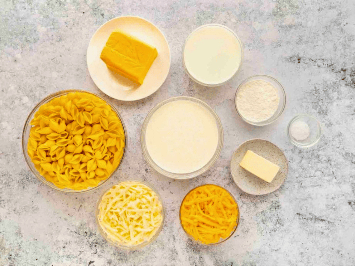 ingredients for mac and cheese in bowls