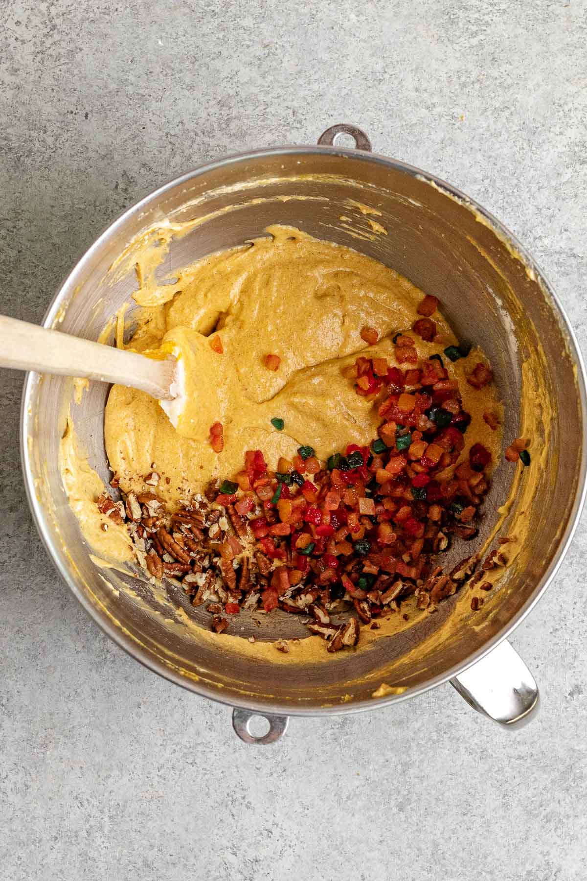 adding fruit cake fruit to mixture 