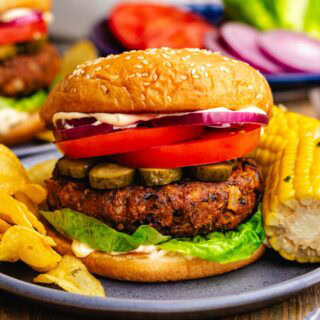 Vegetable burger with toppings on hamburger bun.