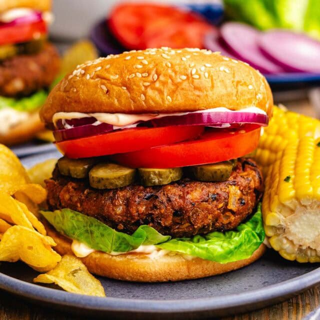 Vegetable burger with toppings on hamburger bun.