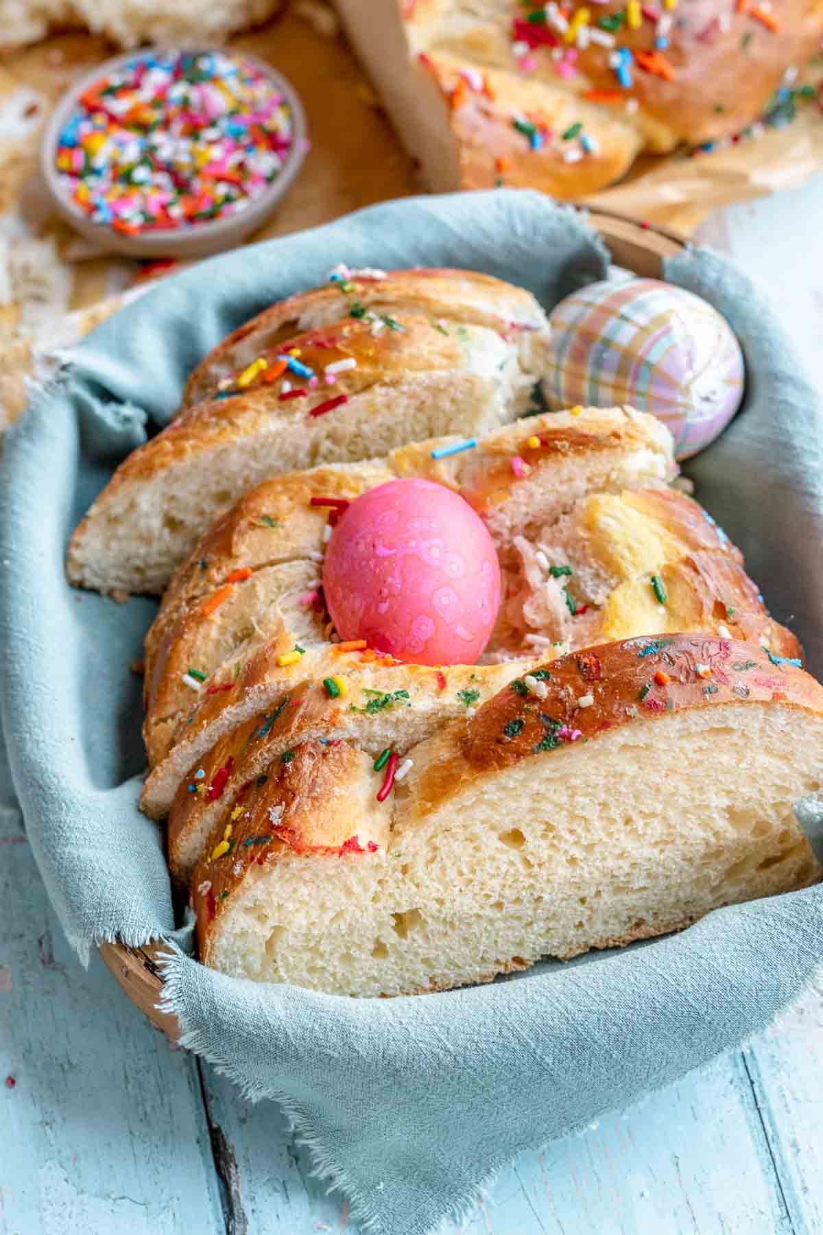 bread with pink egg cooked in it inside of a basket 