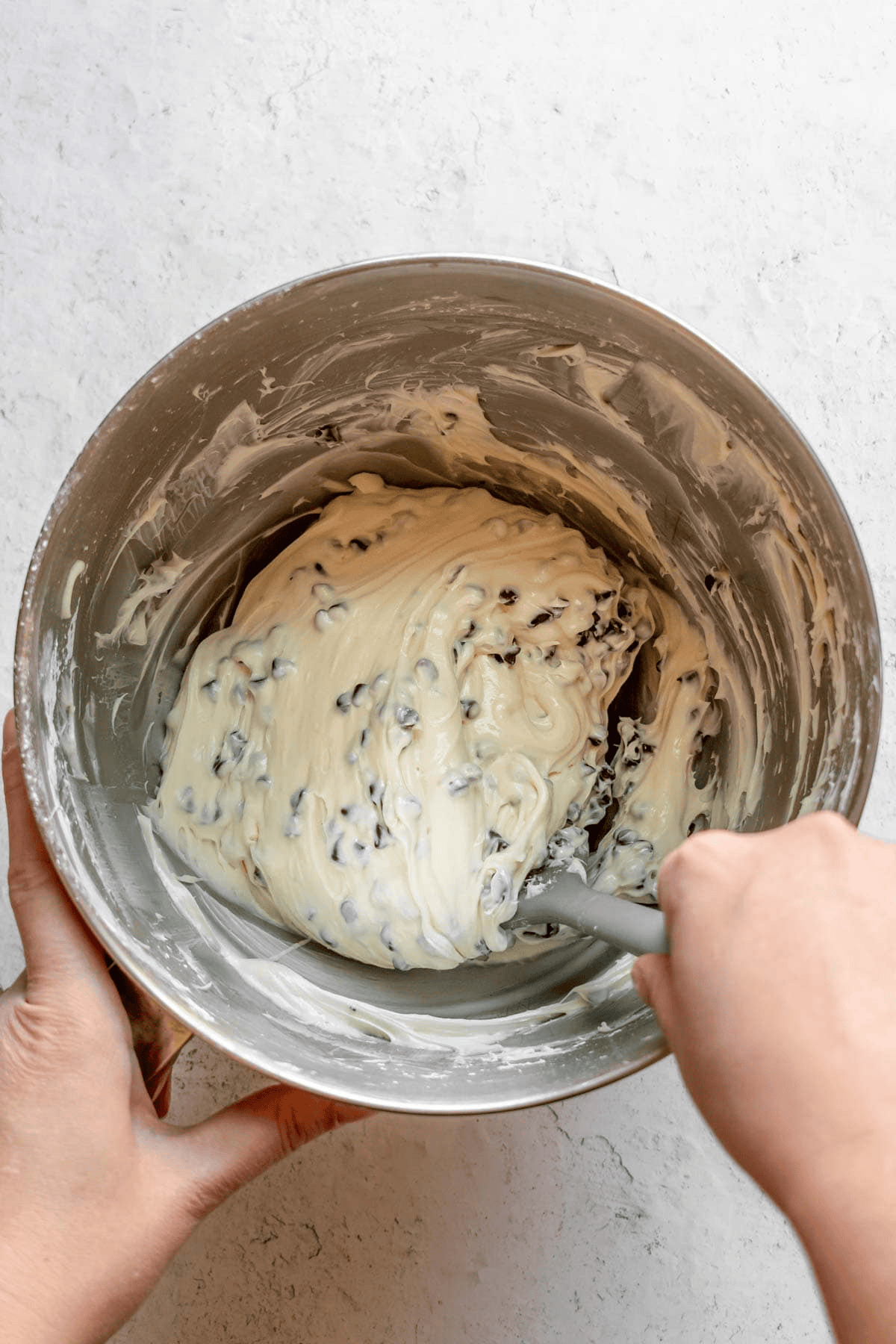 Mixing cream cheese and mini chocolate chips