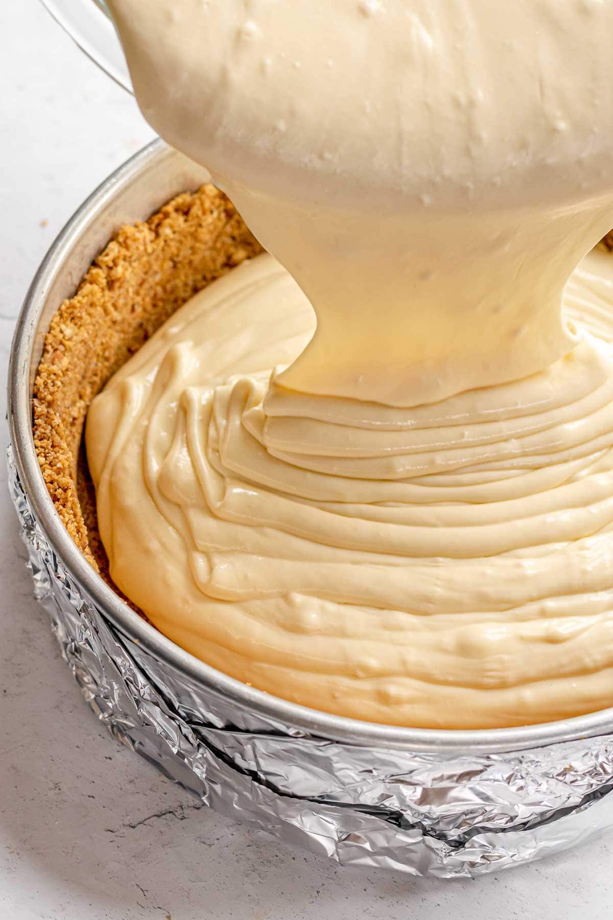 pouring batter in crust 