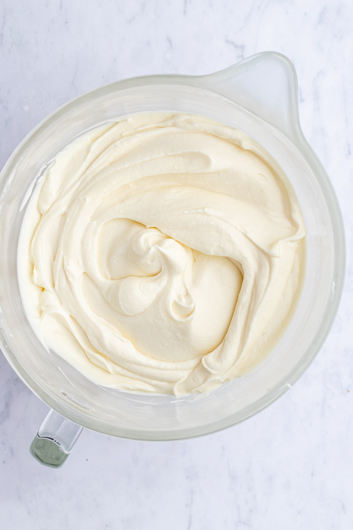 mixing cream in a bowl 