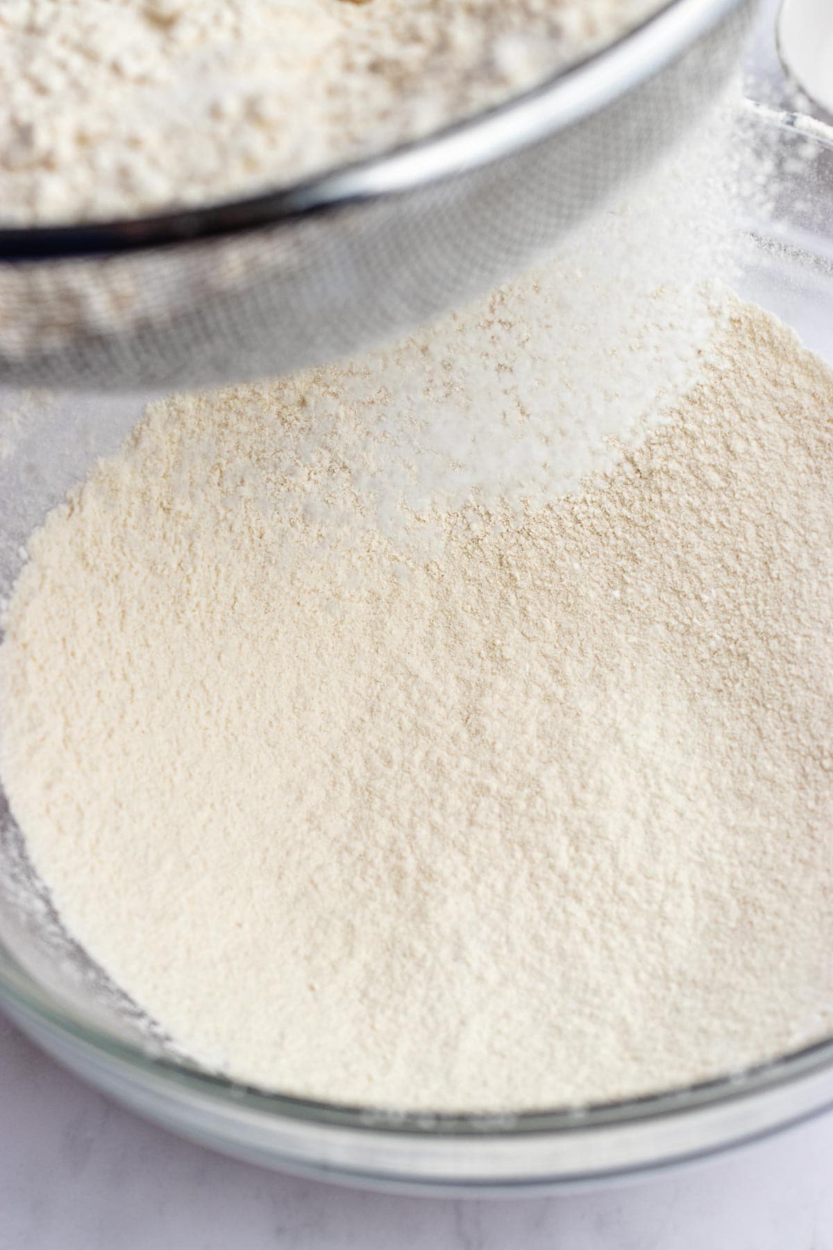 sifting flour into the mixture 