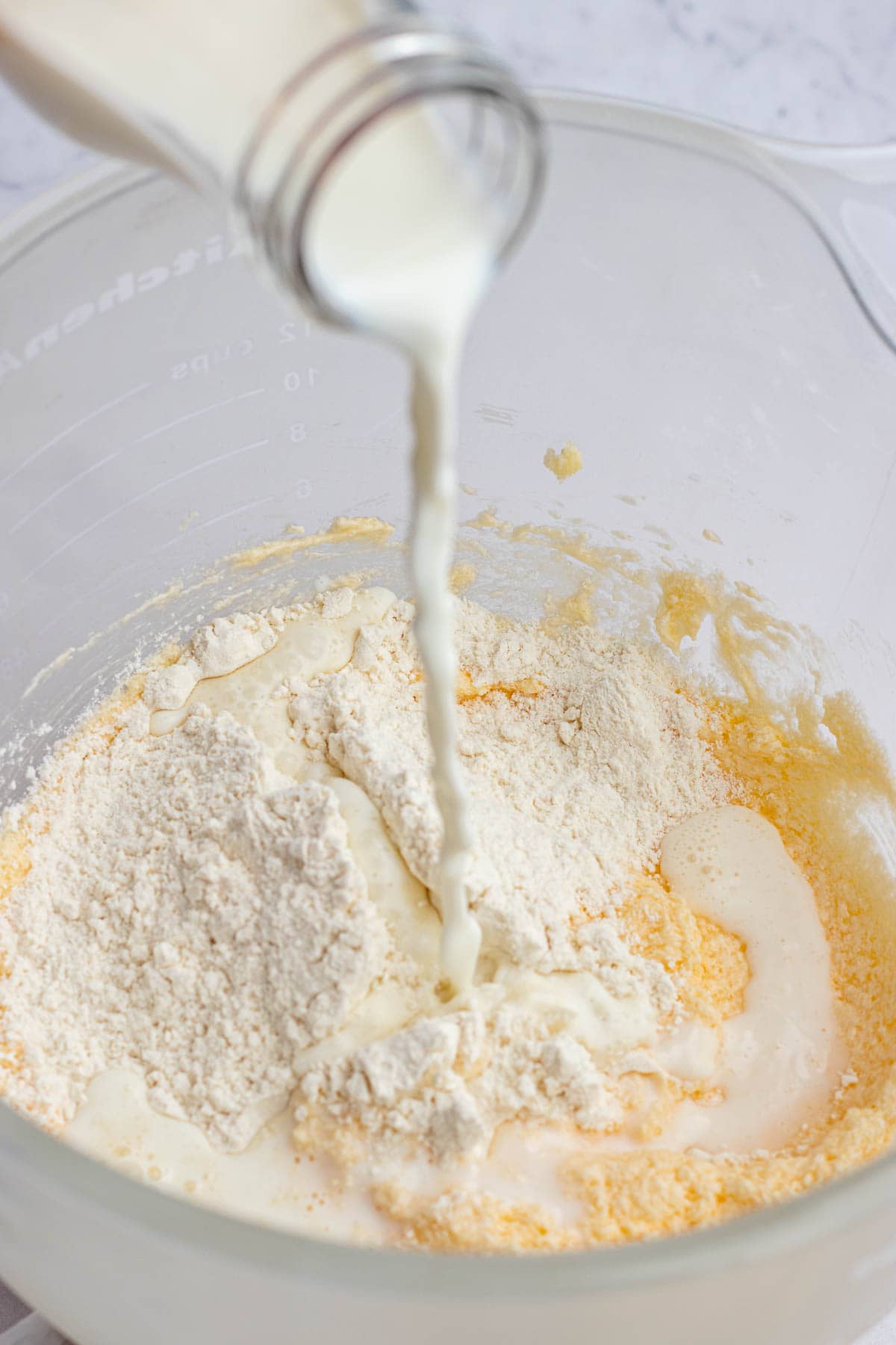 pouring milk into batter 