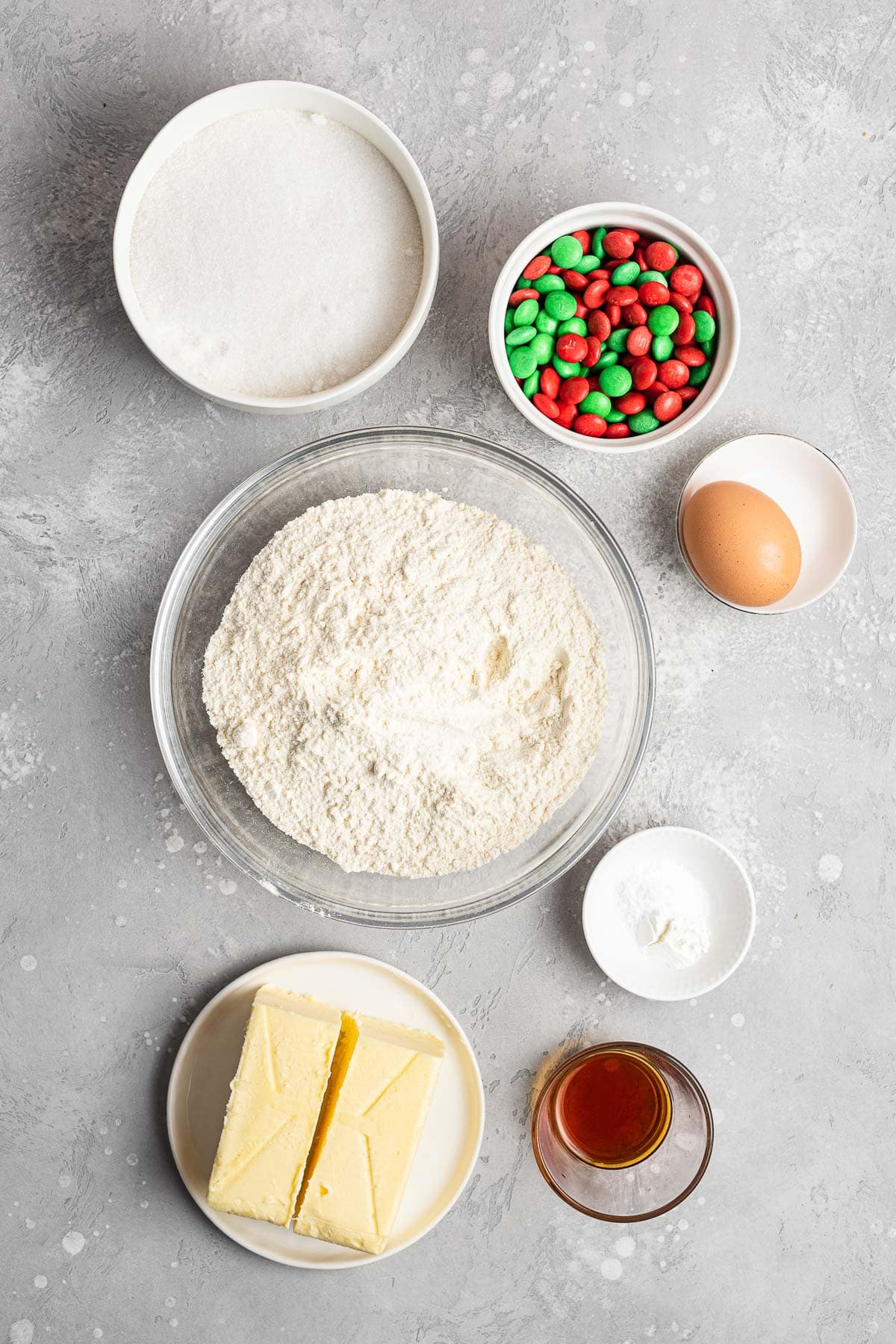 Christmas M&M Cookies ingredients separated in prep bowls and laid out on counter