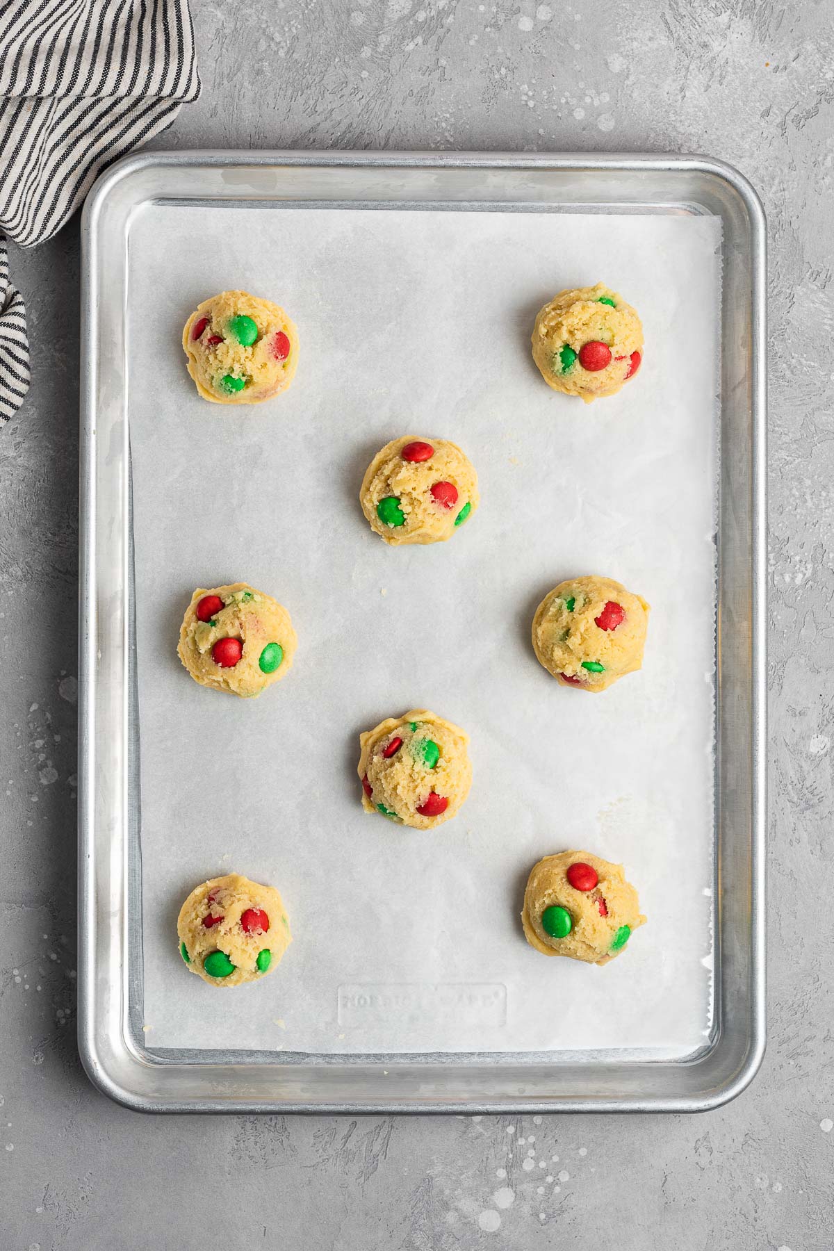 Christmas M&M Cookies dough balls on baking sheet before baking