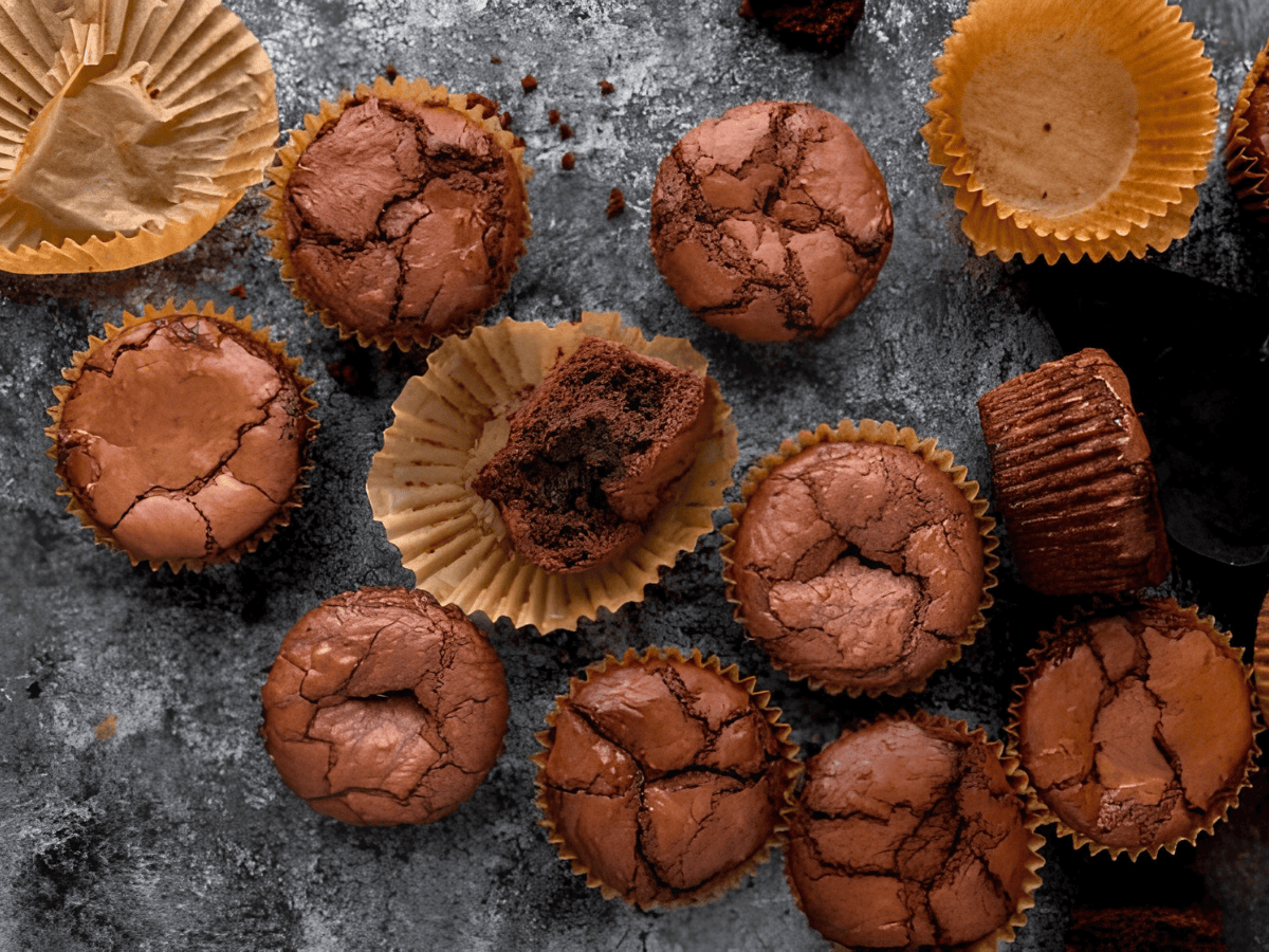 aerial view of round brown chewy desserts with cracks in them scattered side by side