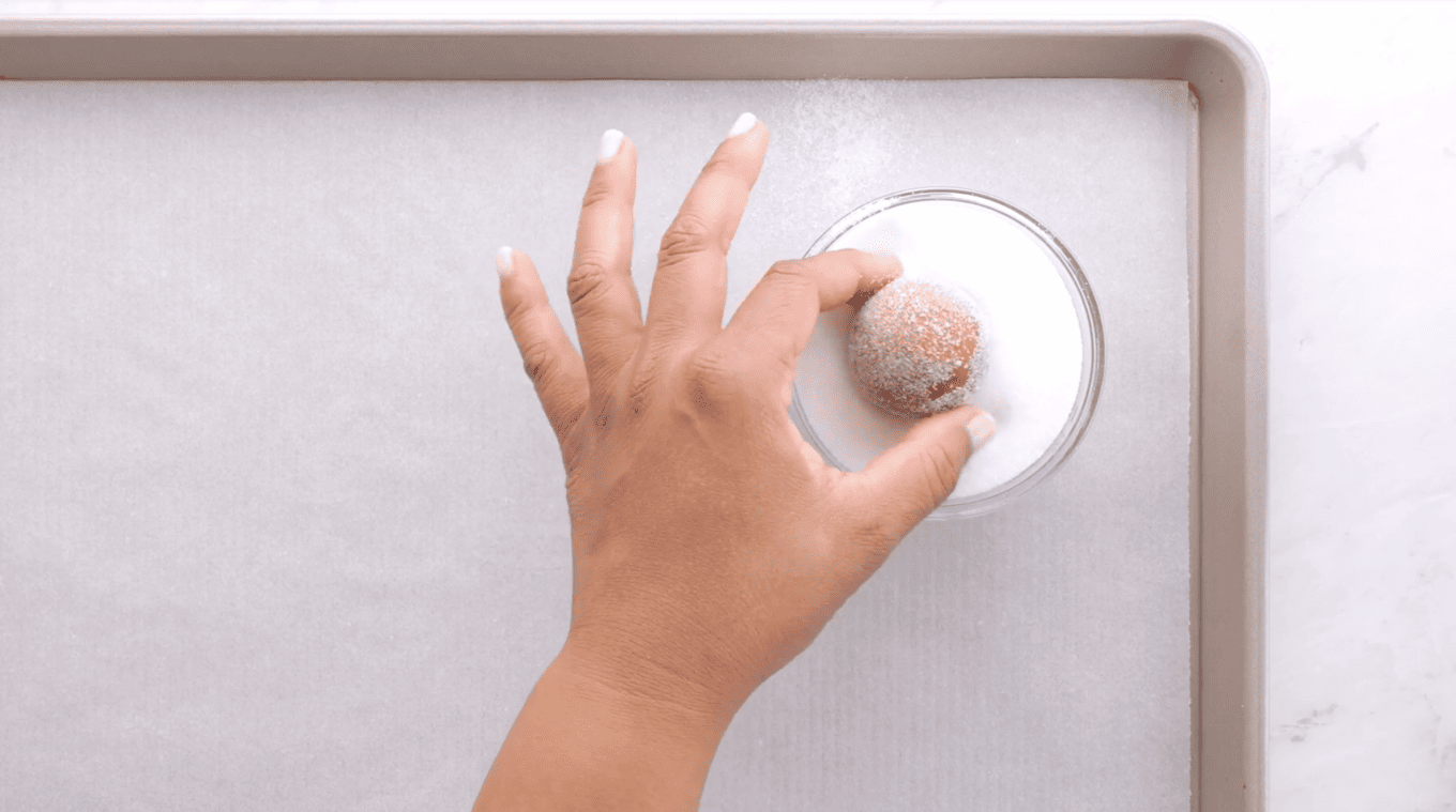 round dough ball dipped into sugar