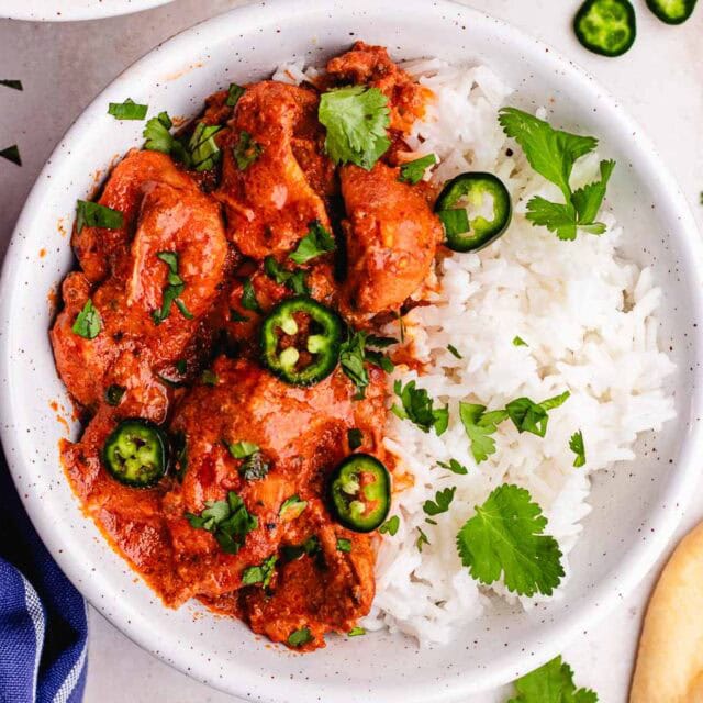 Dinner plate with rice, and Indian curry.