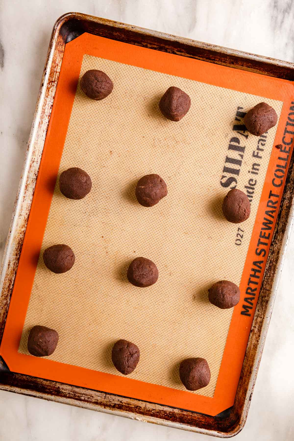 Peppermint Bark Cookies dough balls on baking sheet before baking