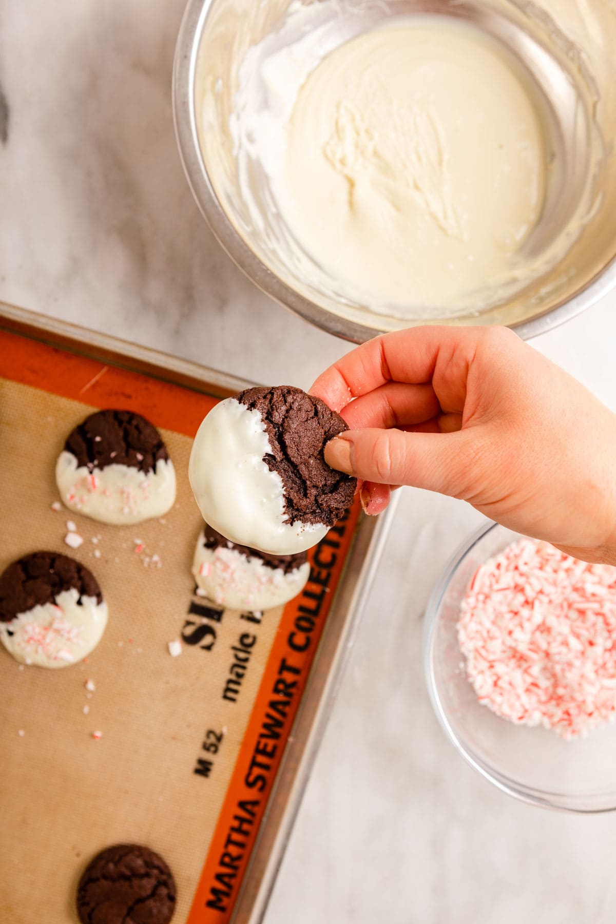Peppermint Bark Cookies dipping cookies in white chocolate