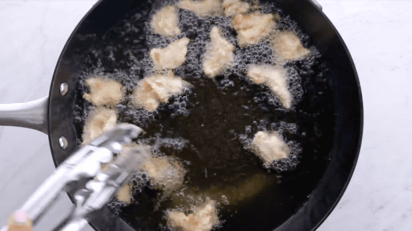 deep frying sesame chicken