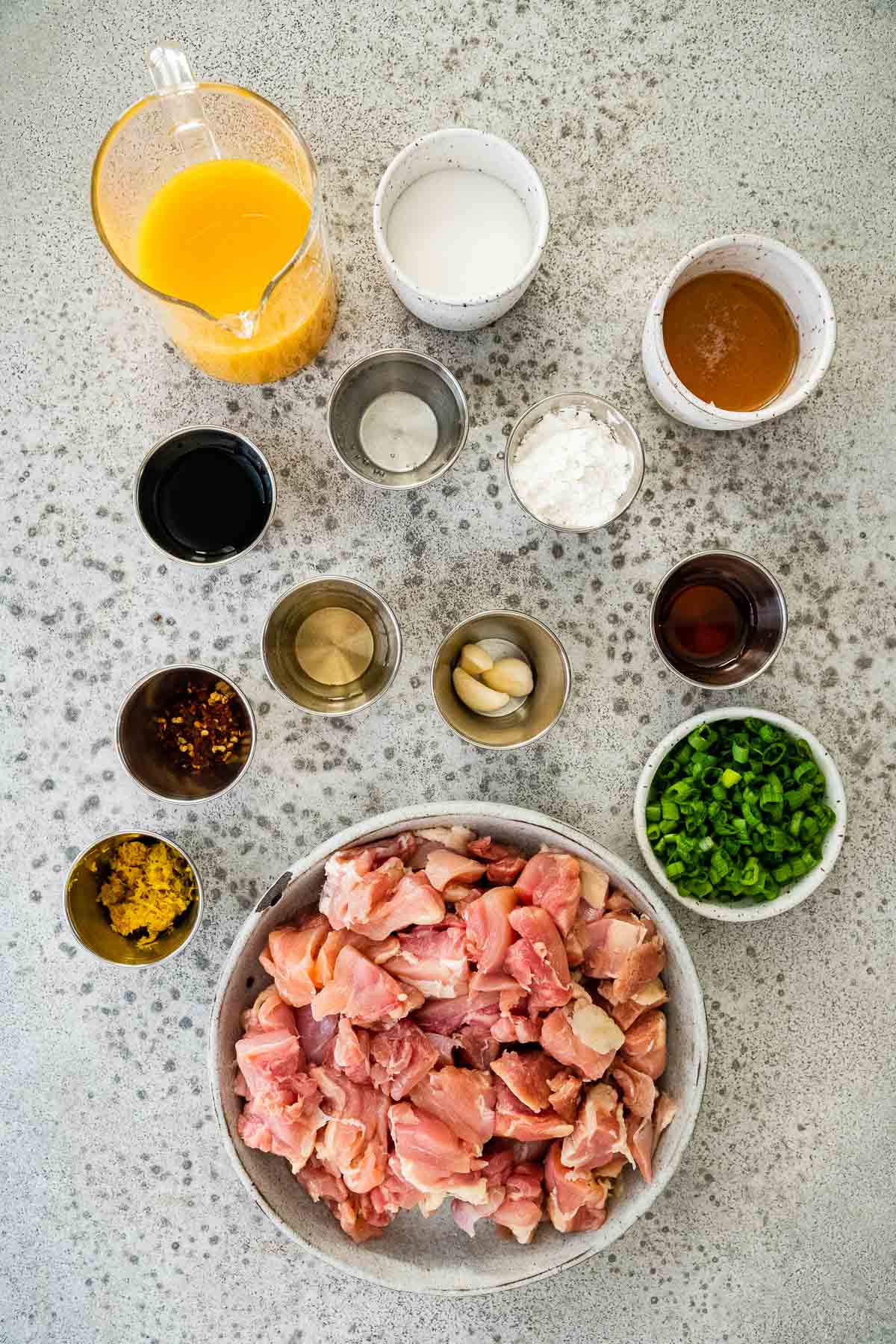 Slow Cooker Orange Chicken ingredients laid out in individual prep bowls