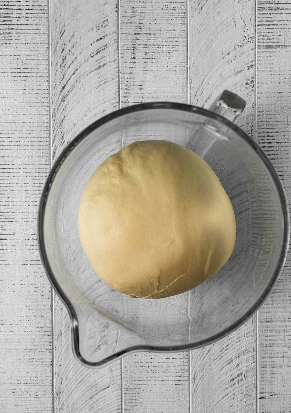 proofed dough ball in bowl