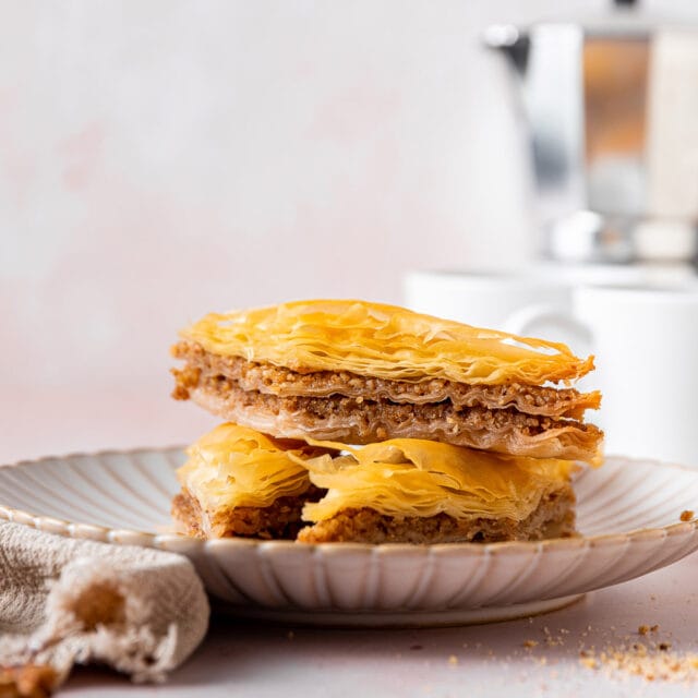 Baklava pieces piled on plate