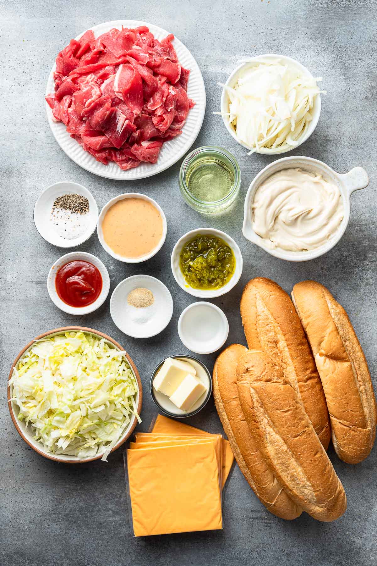 Individual ingredients for the Big Mac Philly Cheesesteak.