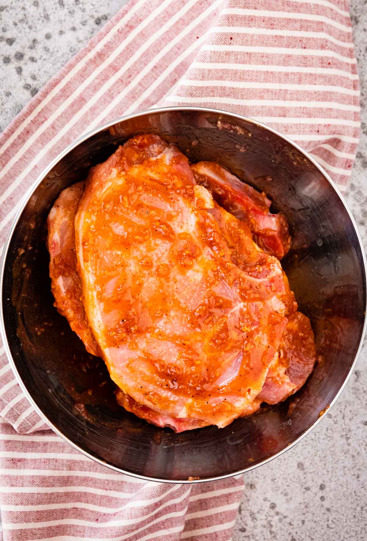 Air Fryer Garlic Butter Pork Chops in the bowl with seasonings