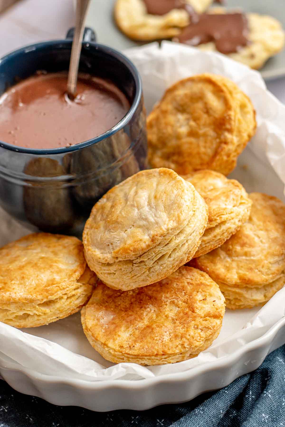 Buttermilk Biscuits with Chocolate Gravy baked biscuits and cup of gravy in basket
