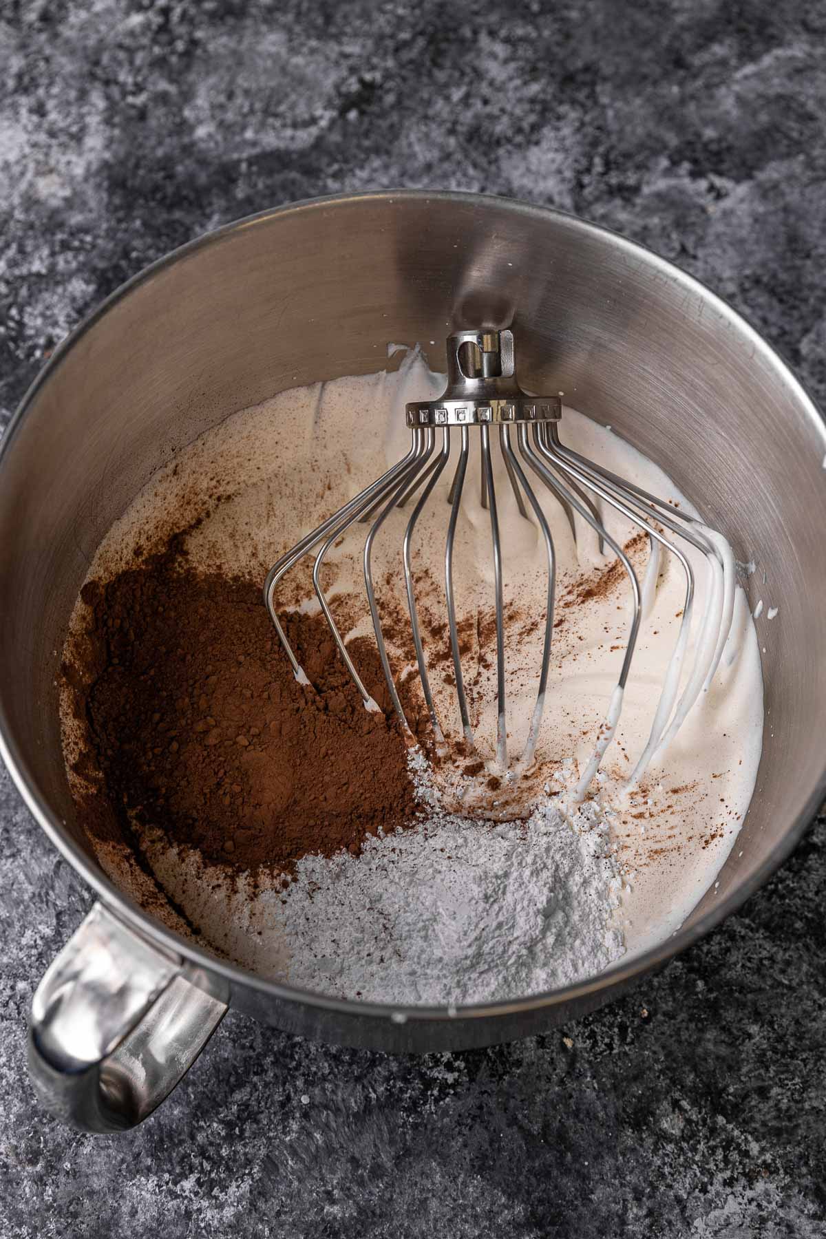 Chocolate Whipped Cream, chocolate being added to the mixing bowl