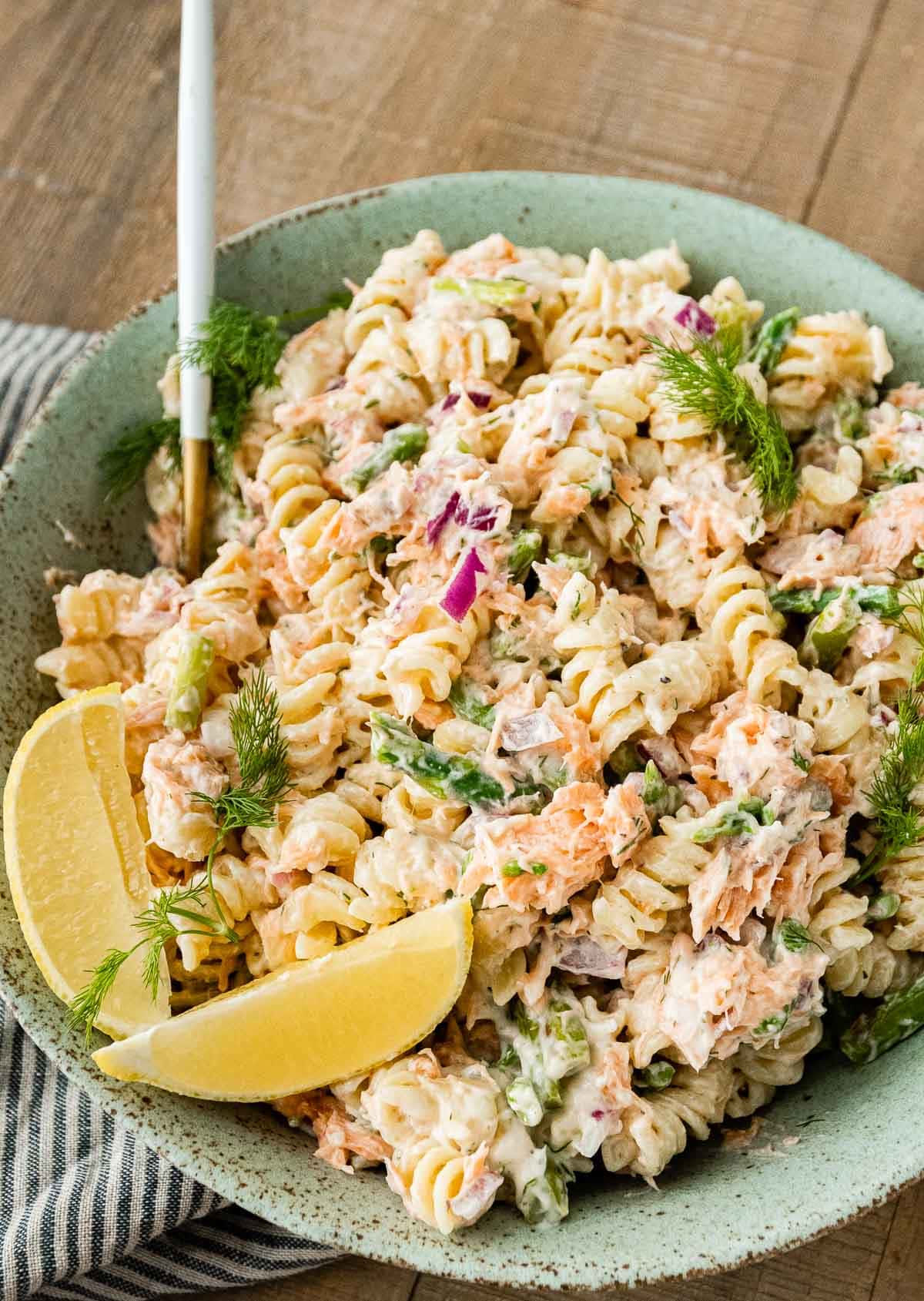 slices of lime in bowl with Dill Salmon Pasta Salad