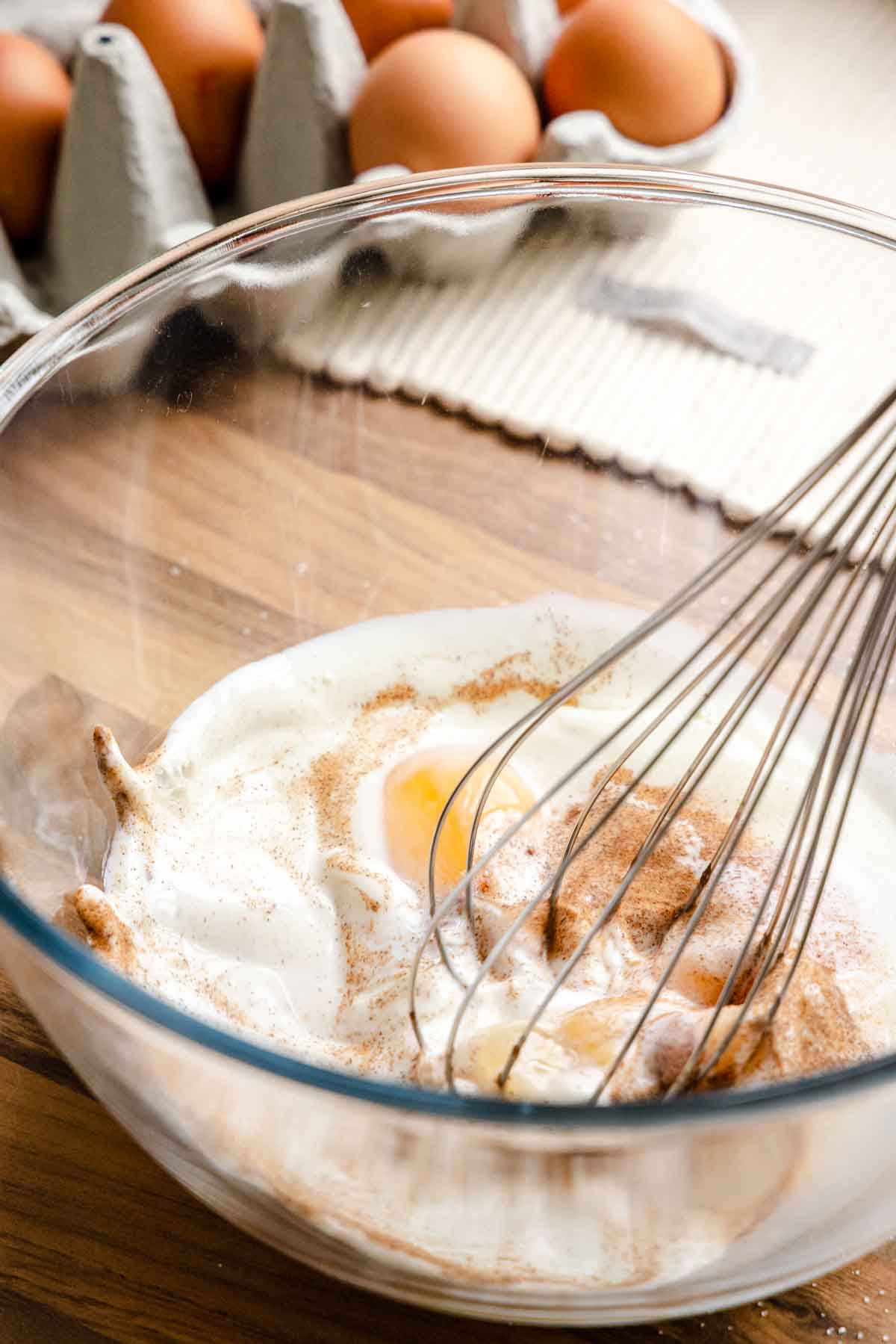 French Toast Sticks quickly whisking egg batter in bowl