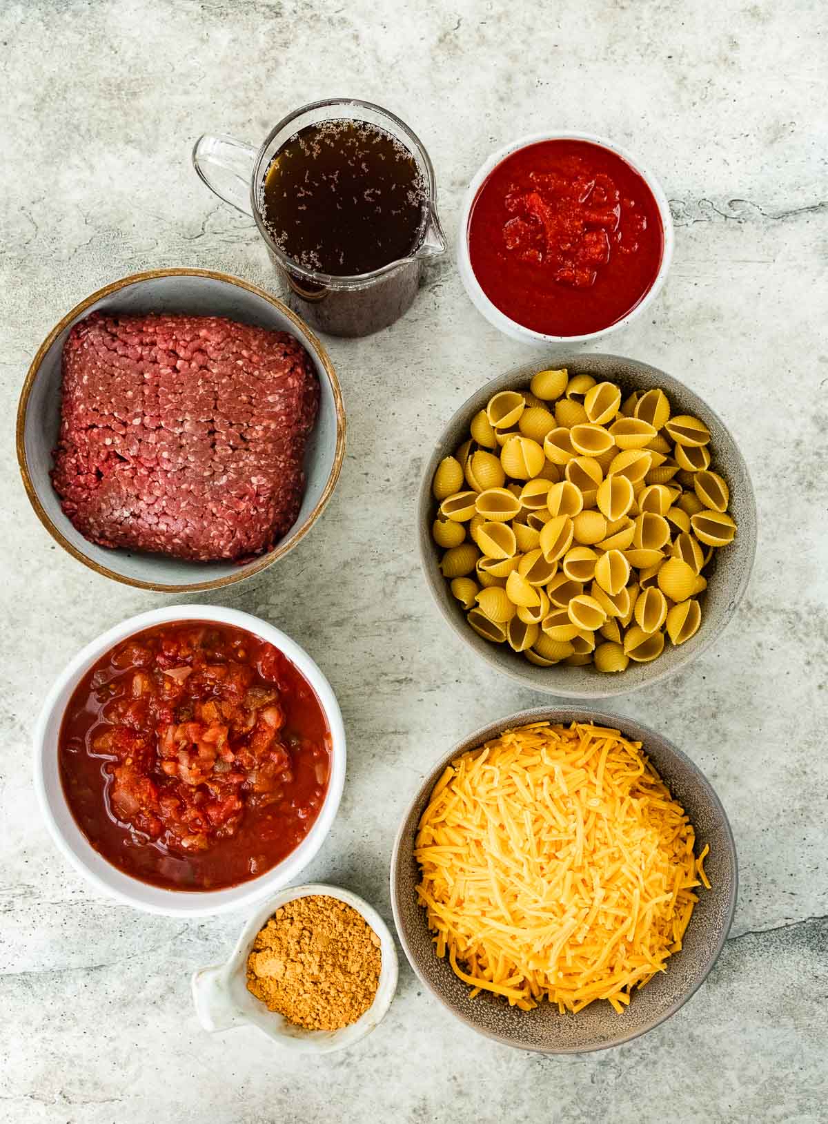 portioned ingredients for Instant Pot Cheesy Taco Pasta