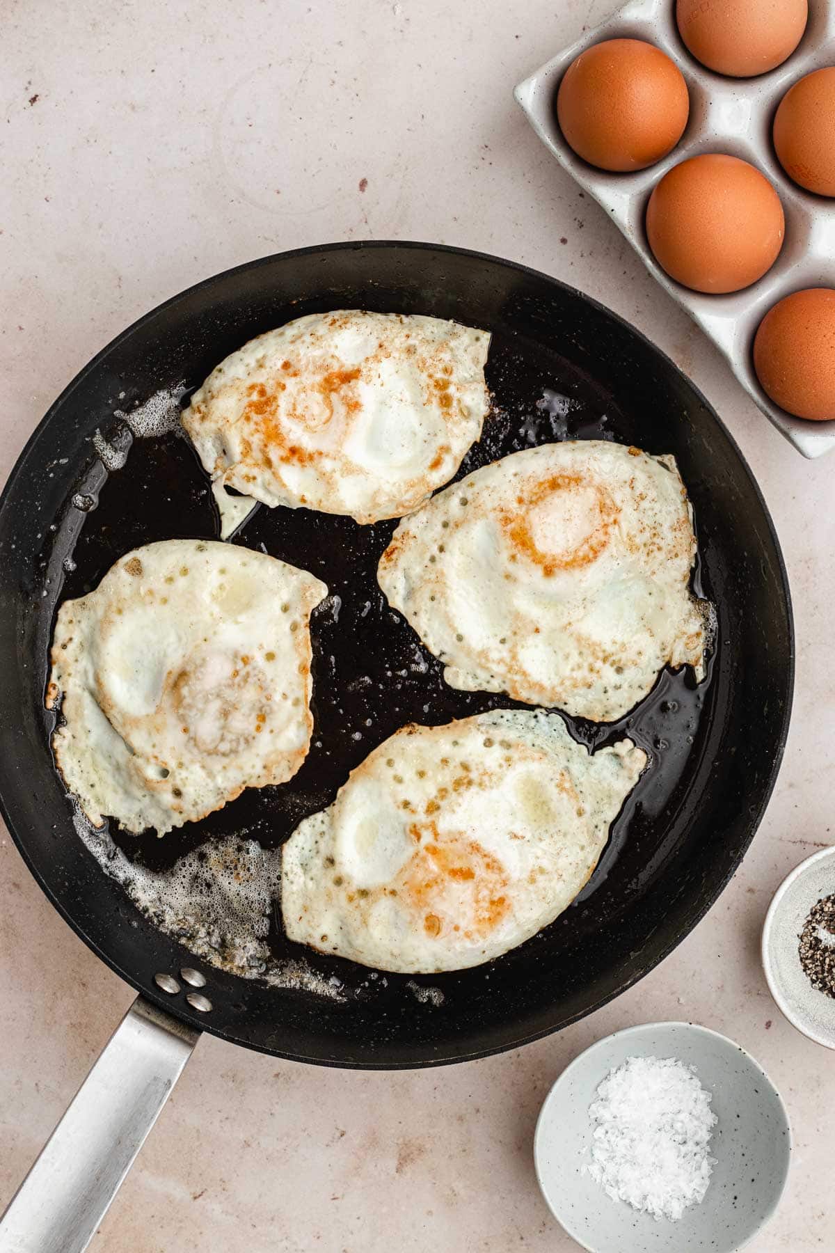 Over Easy Eggs in the pan, flipped