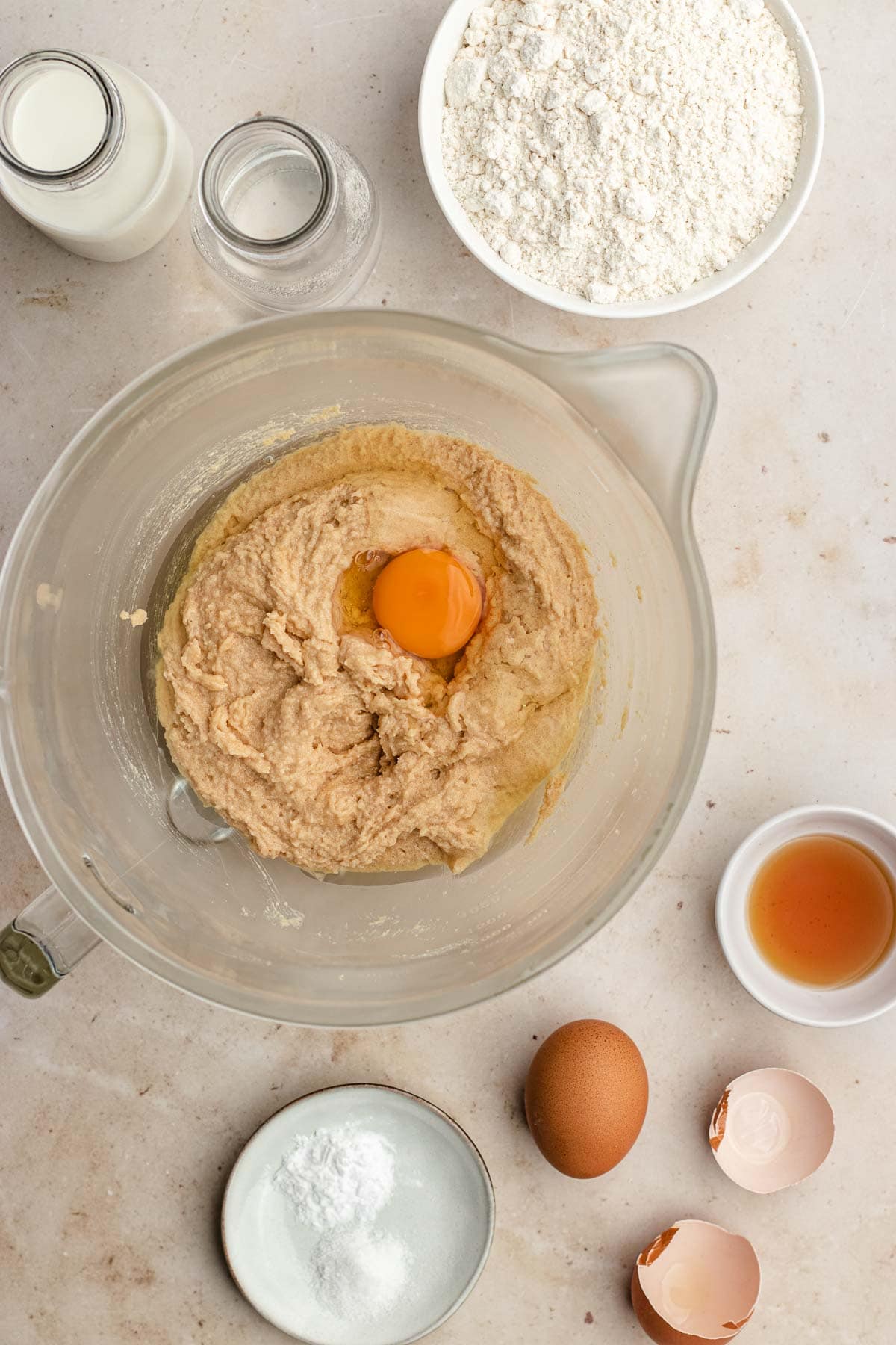Peanut Butter Layer Cake adding eggs to mixing bowl