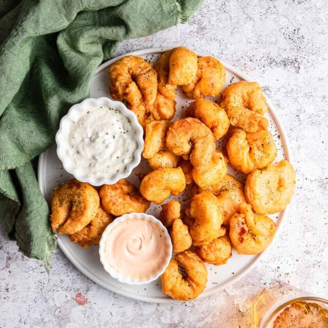 Beer Battered Shrimp on a plate with two dipping sauces