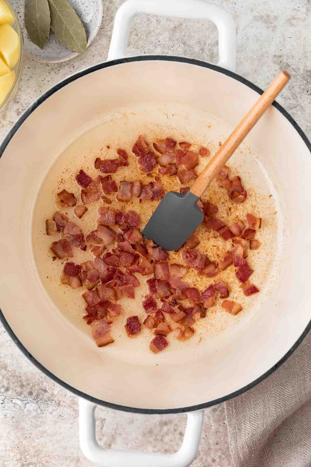 browning bacon in Dutch oven