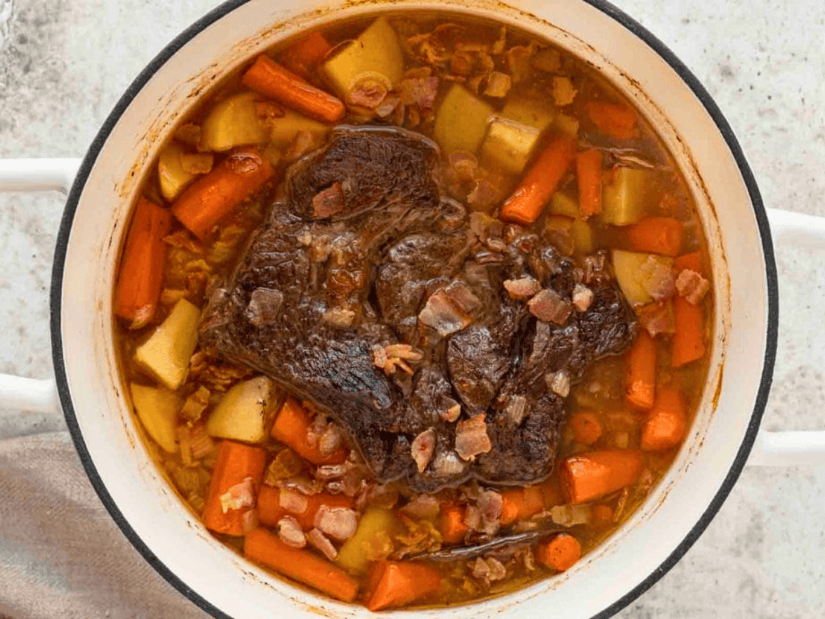 Cooked roast and vegetables in pot