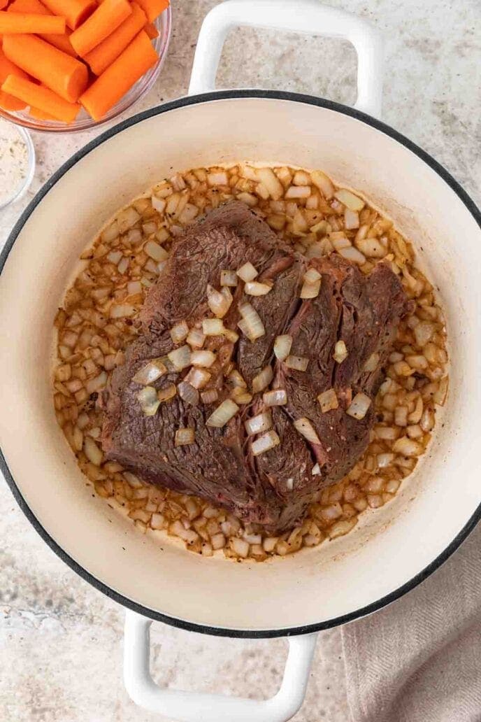 Cooked chuck roast in a Dutch oven