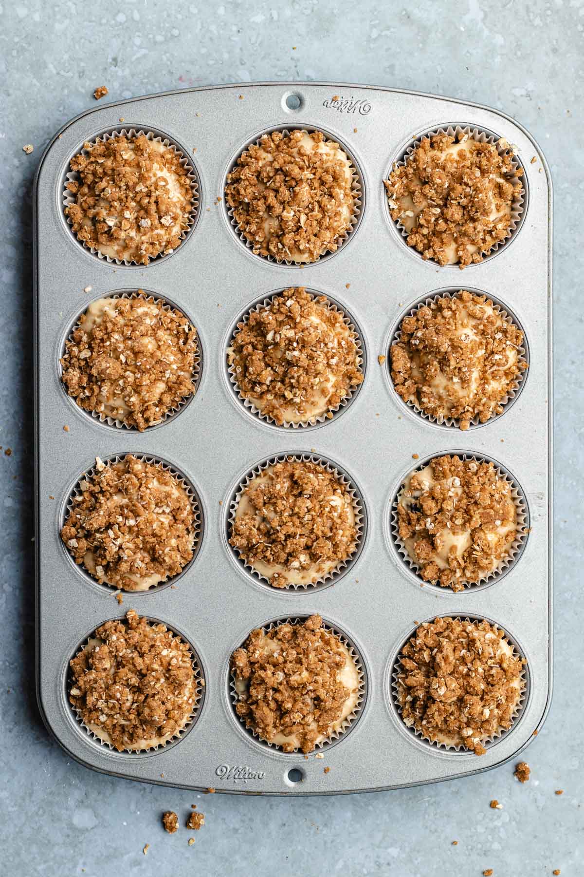 Blueberry Streusel Muffins ubbaked in tin
