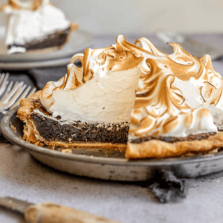 View of pie in tin with slice taken out