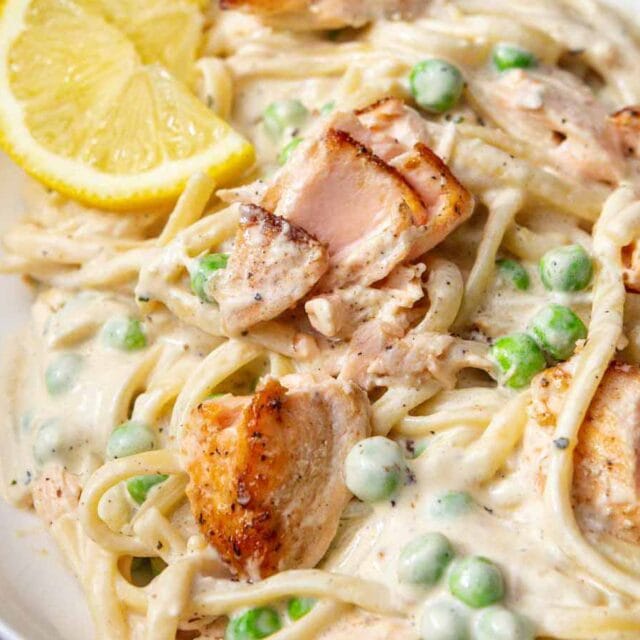 Pasta plated in bowl, garnished with lemon slice 4x3