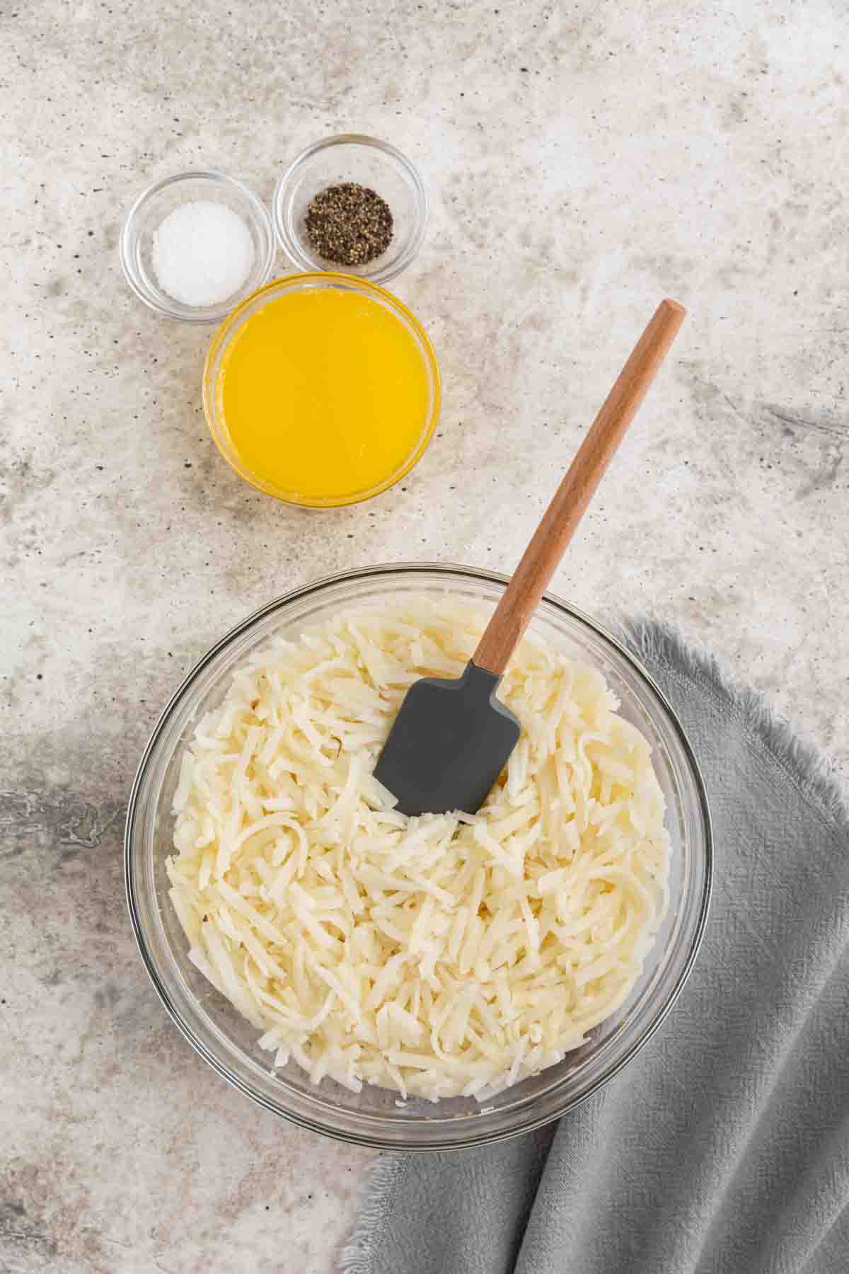 stirring hash browns with spatula