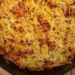 cast iron pan with hash browns