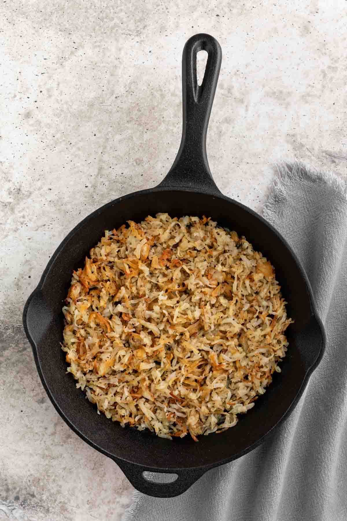 cooked hash browns in skillet