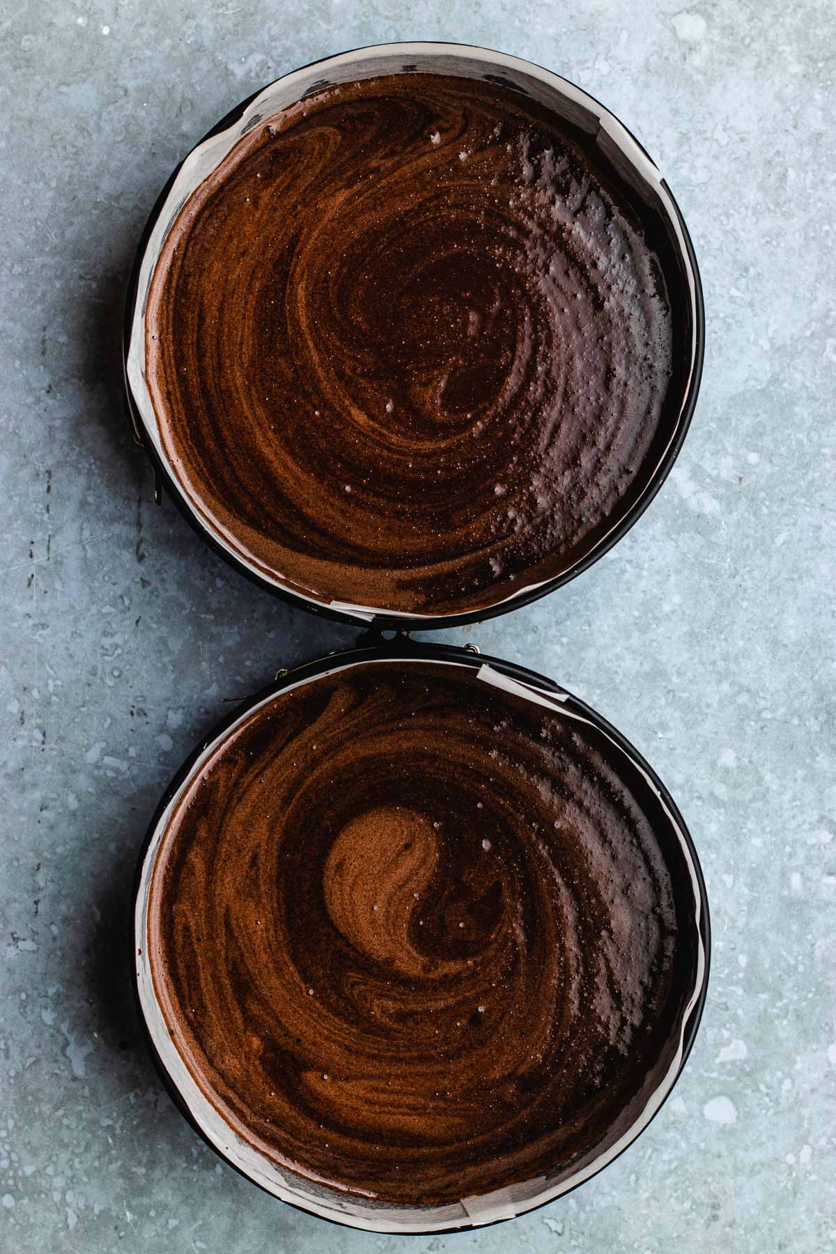 two 9 inch cake pans with raw batter