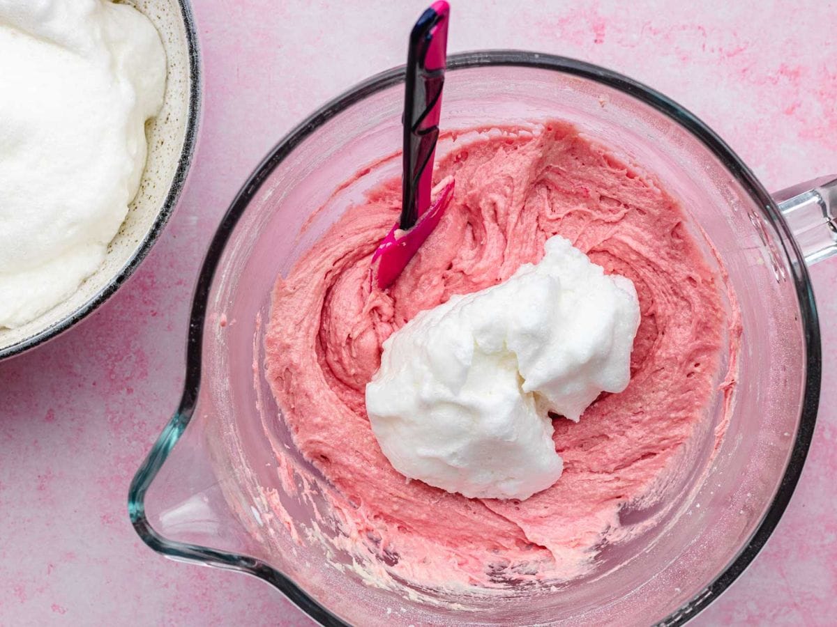 Pink cake batter being mixed
